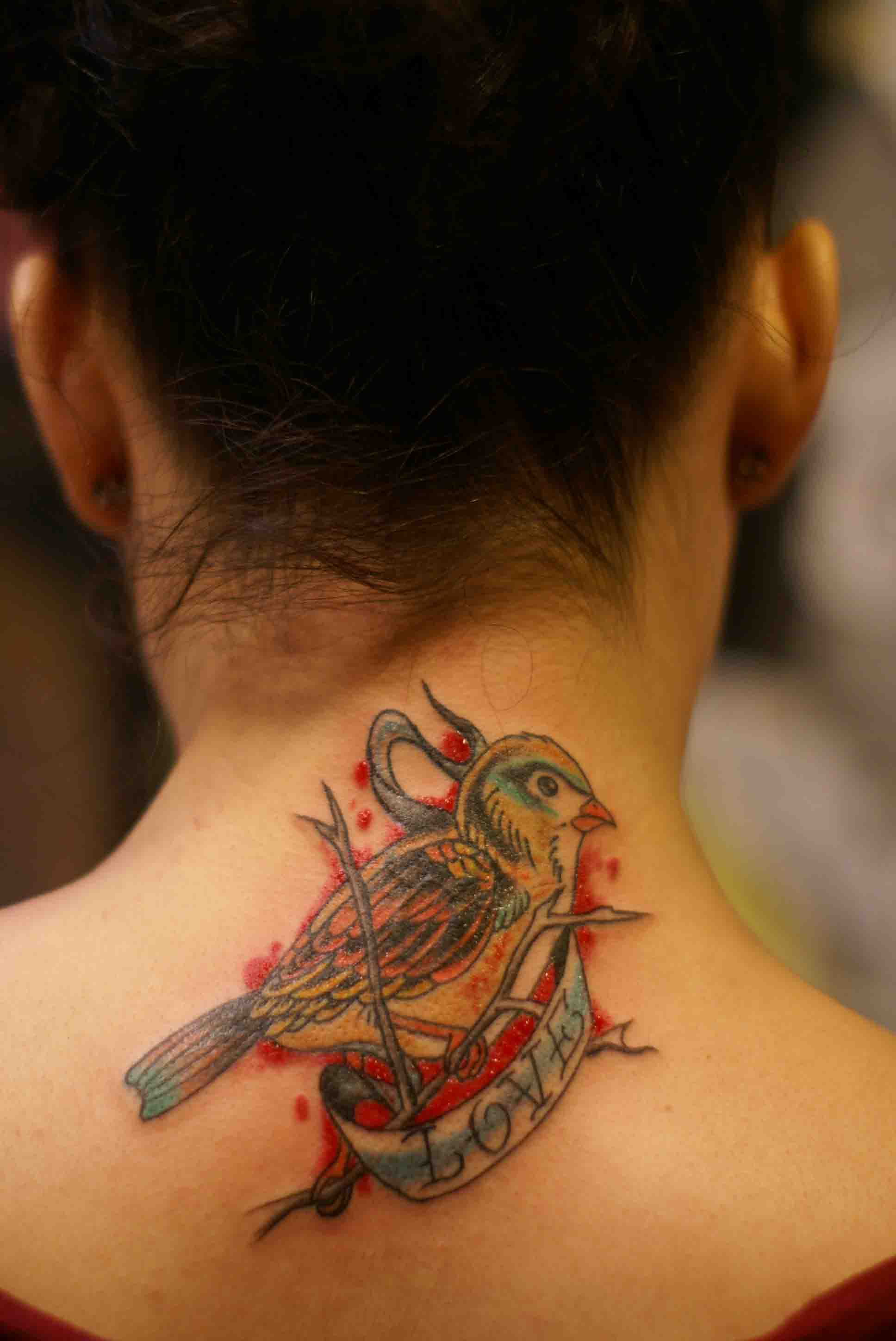 neck tattoo birds